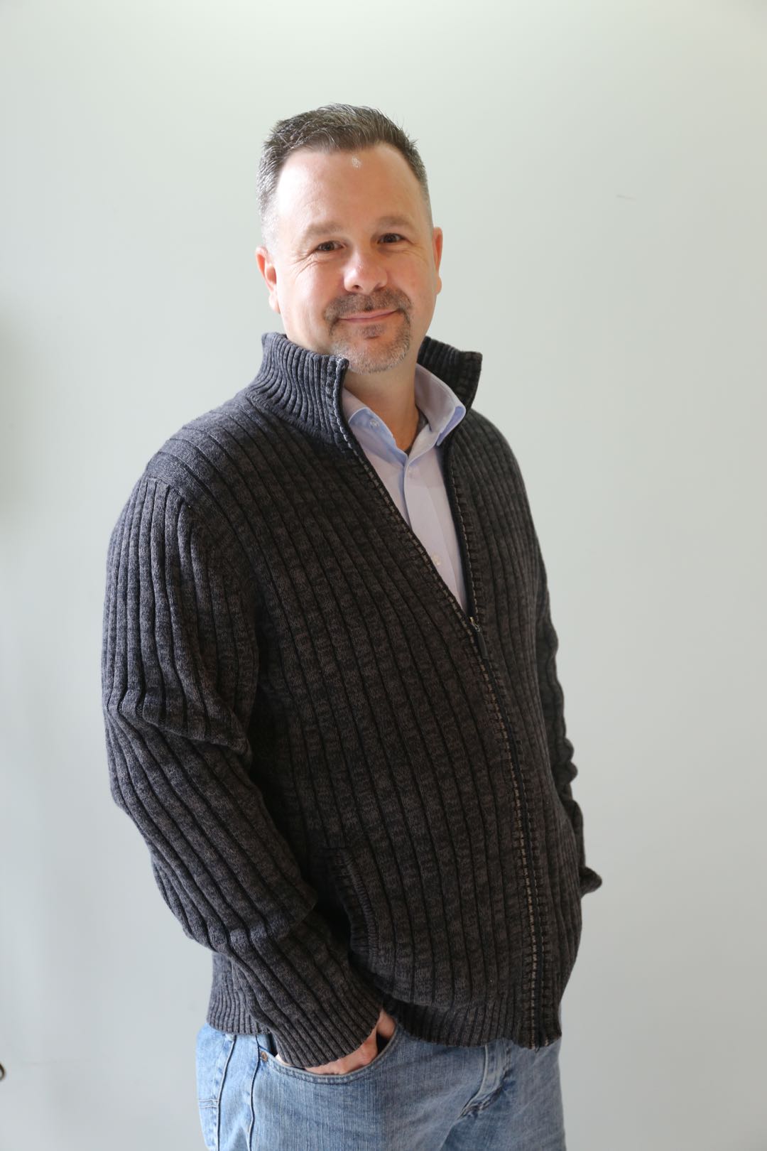 Students working in a studio environment with guidance and peer feedback.